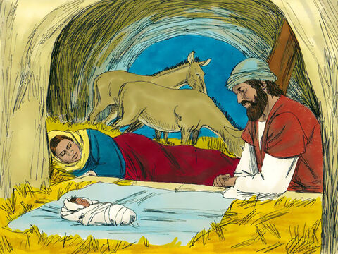 Mary and Joseph place Jesus in a manger in Bethlehem.